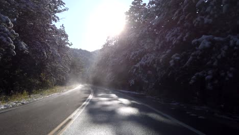 POV-driving-in-the-mountains-after-a-snow-storm