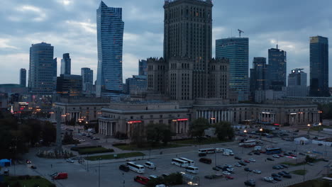 Rising-footage-of-PKIN-building.-Old-monumental-tall-building-in-downtown.-Evening-view-of-skyscrapers.-Warsaw,-Poland