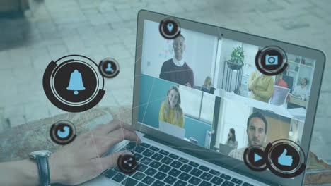 digital internet icons over man using laptop during conference video call.