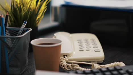 company invoice documents and coffee cup on accounting office desk