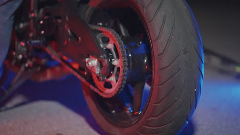 motorcycle rear wheel at night