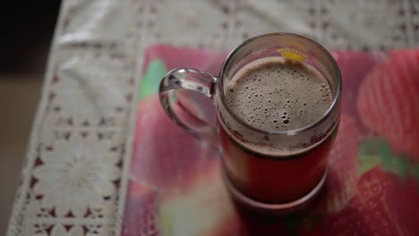 there is a coffee mug on the kitchen table