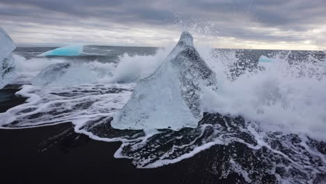 icebergs on a black sand beach
