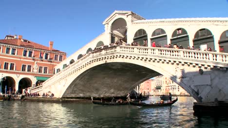 gondolas under the rialto bridge in venice italy 2