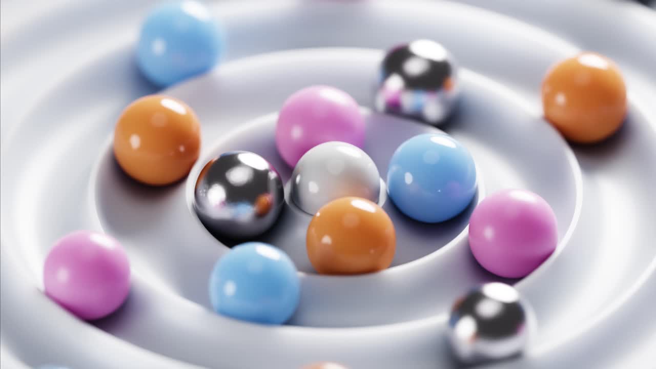 Bunte Kugeln, rollend und in konzentrischen Rillen