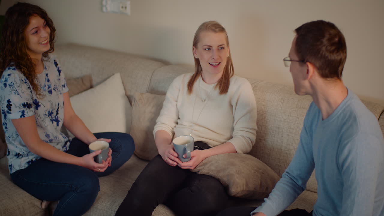 Group of friends having a conversation on a couch