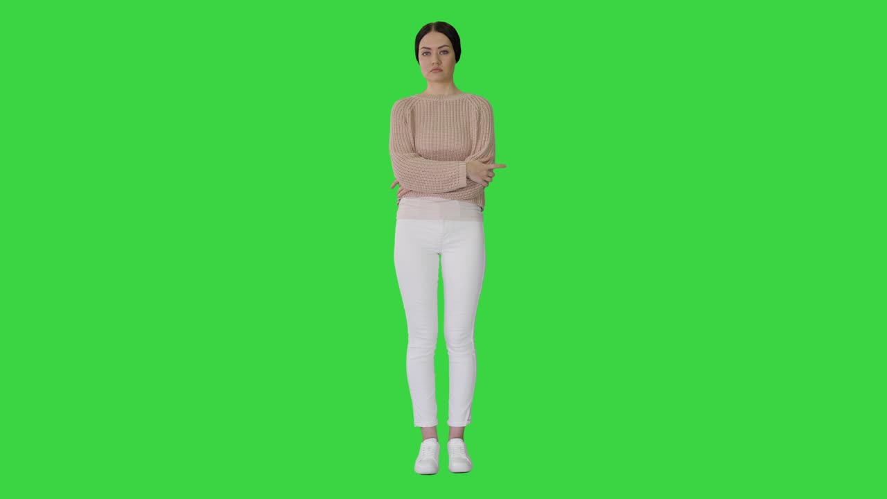 Casual woman standing doing nothing on a Green Screen, Chroma Key