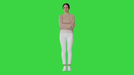 casual woman standing doing nothing on a green screen, chroma key