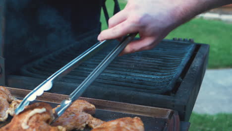 Various-shots-of-grilling-and-cooking-chicken-on-an-apartment-style-BBQ-grill