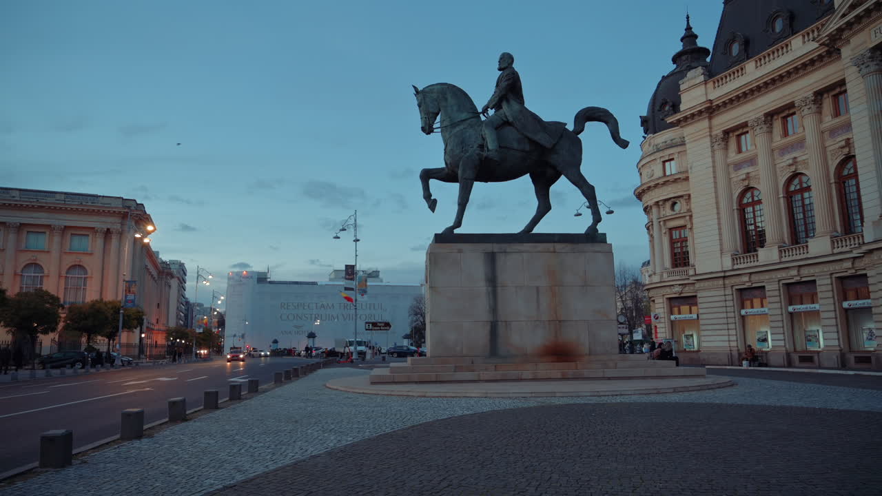 Cars passing by the Central University Library Carol I in Bucharest, Romania