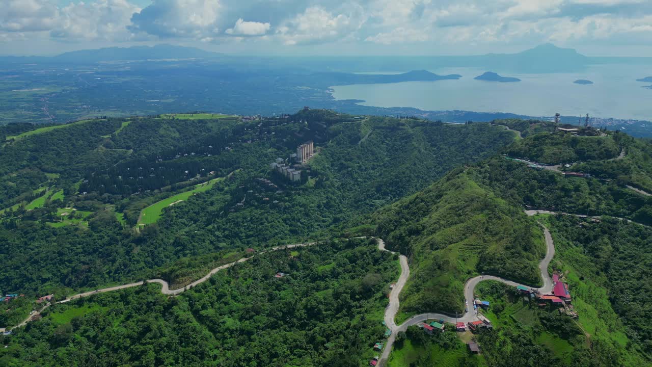 A wide aerial of the winding hill road near People's Park in the Sky in Tagaytay, Cavite, Philippines