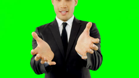 businessman pretending to hold an invisible object 4k