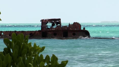 rusty remains of a shipwreck near fanning island, tabuaeran, republic of kiribati