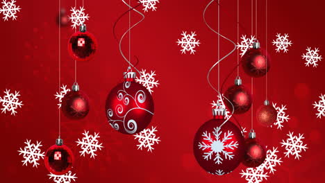 animación de bolas de navidad sobre copos de nieve sobre fondo rojo