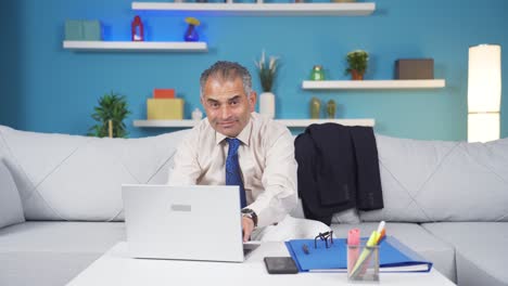 Home-office-worker-man-waving-at-camera.