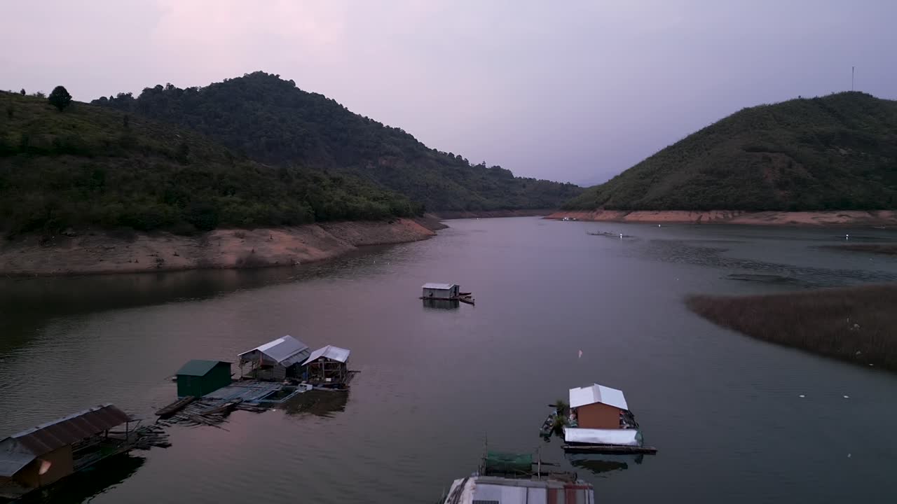 Floating Houses on a Mountain Lake
