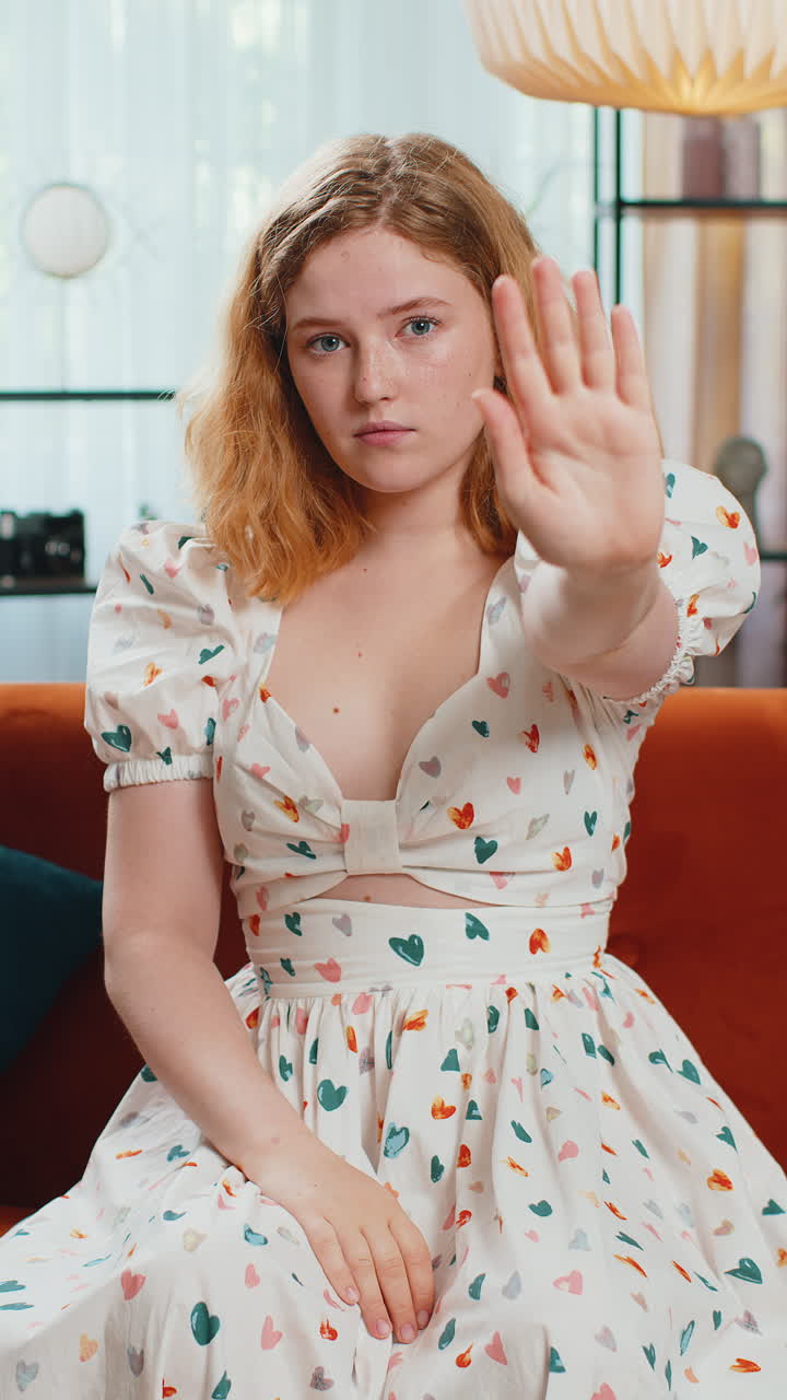 Angry woman say no hold palm folded crossed hands warning of finish stop gesture declining talk