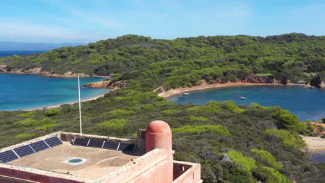 Aerial-back-traveling-over-the-Fortress-Langoustier-beach-Porquerolles-France