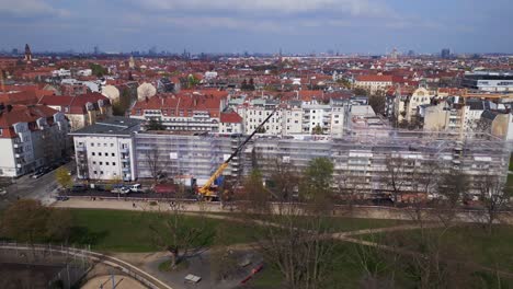 vehicle crane perfect aerial top view flight berlin city construction work on house with crane