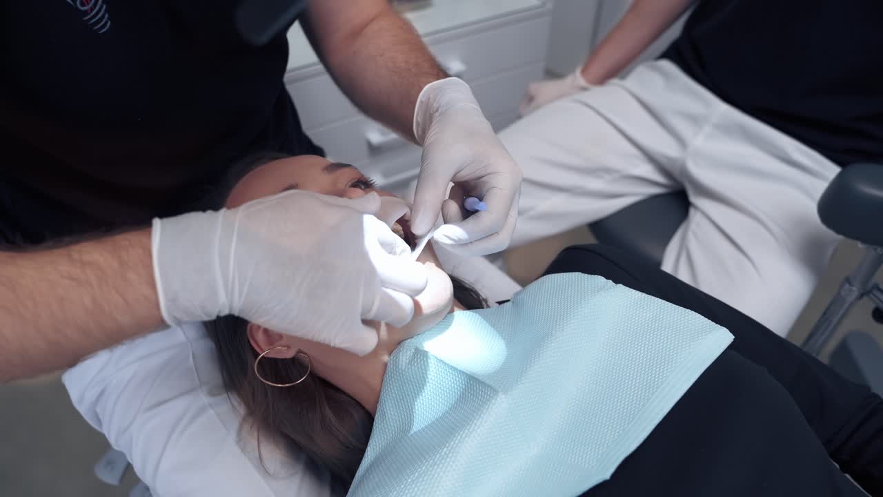 Dental oral procedure. Beauty cosmetic procedure for woman teeth in stomatology