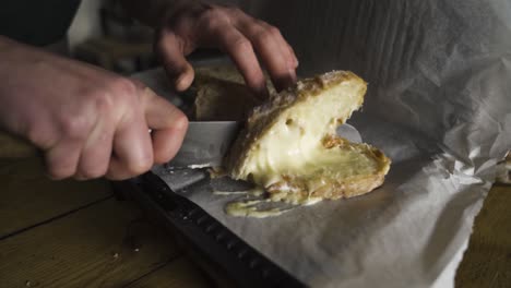 man cutting a toastie in coffee shop barrister slicing bread warm cheesy toasty short version shot in slow mo on a7 iii