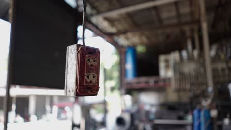 old and worn electrical outlet in a workshop