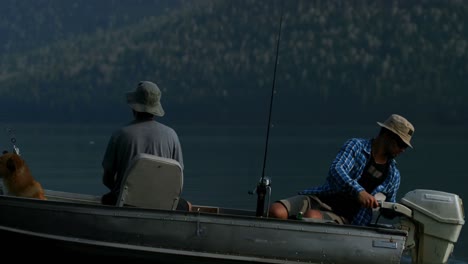 fishermen fishing with his dog in the river 4k