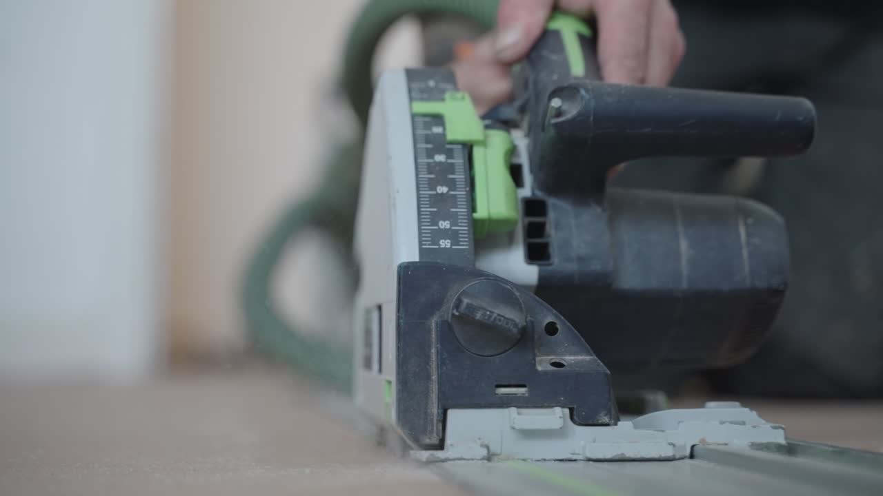 Close-up of a Carpenter Using a Circular Saw to Cut Wood