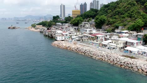 Waterfront-residential-buildings-in-Hong-Kong-bay,-Aerial-view