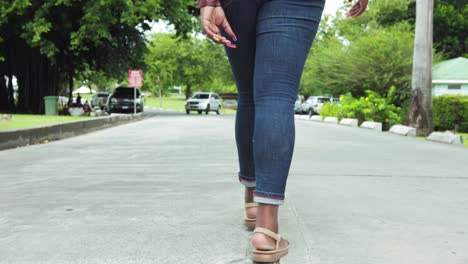 black woman walks away from camera