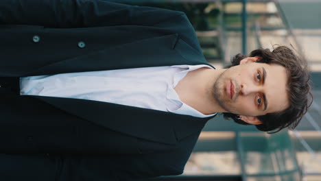 confident businessman in suit with arms crossed