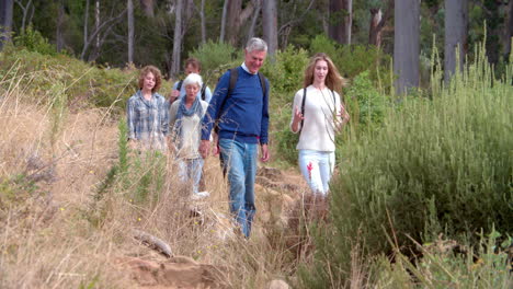 multi-generation family walking on a country path