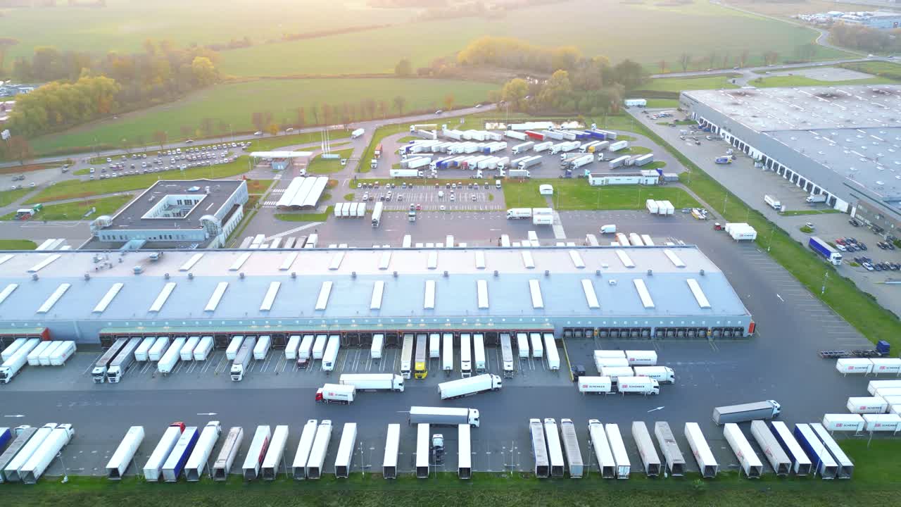 Aerial shot on a logistics park with a warehouse - a loading hub