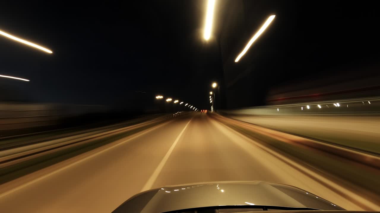 Driving car through city streets at night