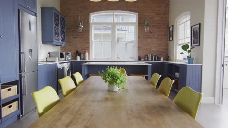 interior of open plan kitchen and dining room with table and chairs