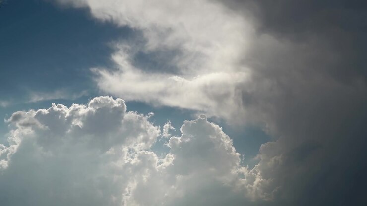 Dramatic Storm Clouds Moving Across a Bright Blue Sky