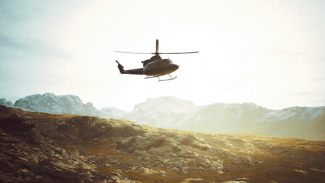 helicopter flying over mountain landscape during golden hour in the wilderness