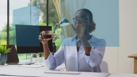 woman looking at projected screen sitting at desk interacting with ar technology