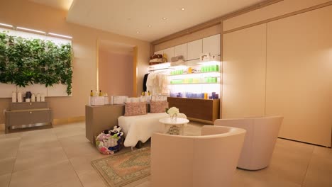 Push-in-shot-of-the-waiting-area-in-a-luxury-spa-with-chairs,-couches,-and-products-for-sale-in-the-background