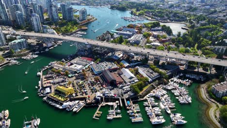 boats and ferry terminals with granville island in vancouver, british columbia, canada