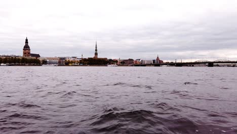 Rough-water-of-Dauguva-river-with-Riga's-city-skyline-in-the-distance