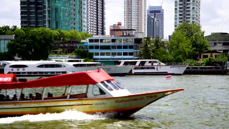 river taxi going past on chao phraya river in bangkok