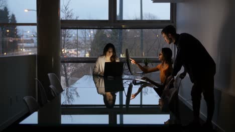 executives interacting with each other during meeting in conference room