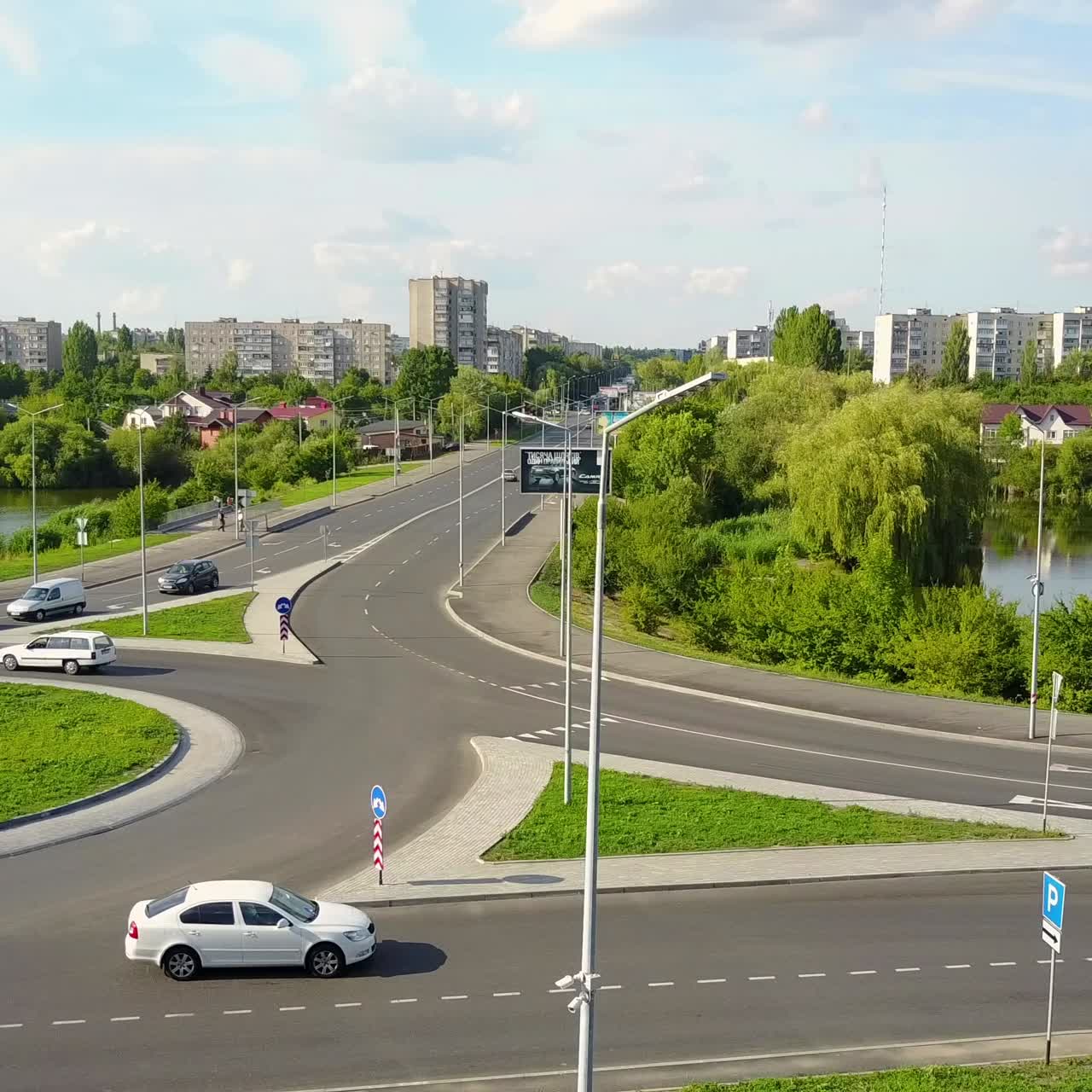 Circular Movement At The Traffic Intersection. VINNITSA, UKRAINE - JULY 2017: Aerial view of roundabout in the city in the summer in Ukraine