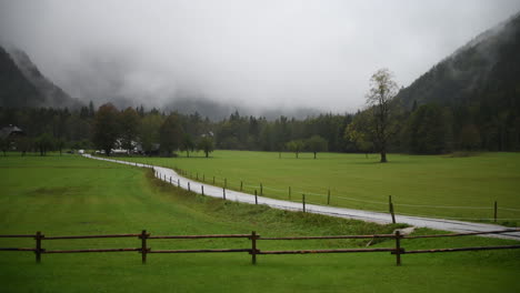 Rainy-day-in-Alpine-valley-with-low-clouds,-Logarska-dolina,-Slovenia,-European-Alps,-bad-travel-weather,-hiking-in-mountains