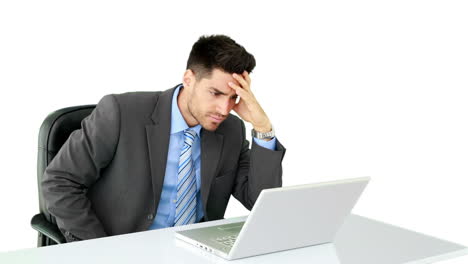 Young-businessman-working-at-his-desk