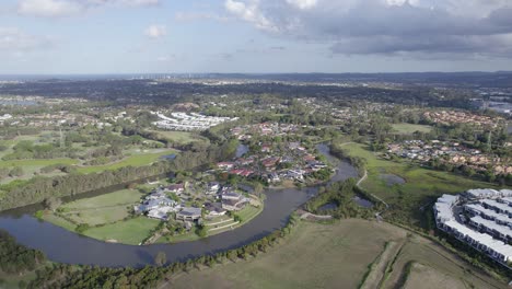 mudgeeraba creek with surrounding suburbs in robina town, queensland, australia