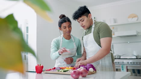 Cooking,-couple-and-vegetables-in-a-home-kitchen