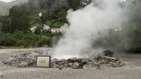 bubbling natural hot volcanic spring with steam rising in the azores