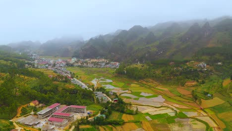 rice terraces settled in the misty mountains surrounding the town of dong van on the dong van karst plateau geopark